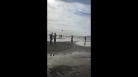 Helicopter disperses swimmers from Gulf of Finland beach in Sosnovy Bor