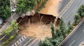 Massive sinkhole opens on road as water and sand surge hits metro construction site