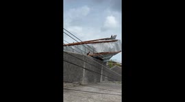 Snapped utility pole renders road to La Vue Hotel impassable after hurricane Beryl in St. Vincent and the Grenadine