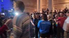 People chant with joy as the first election poll shows the Conservatives are no longer in power