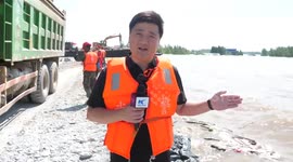 On-site: All-out efforts underway to repair breached dike at China's second-largest freshwater lake