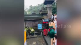 Tourists shocked as tree falls onto temple building in Bali