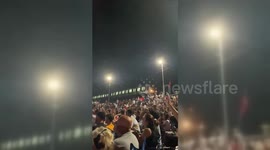 Turkey: Istanbul Commuter Rail Car Pauses to allow passengers to catch a glimpse of Turkey-Austria Match