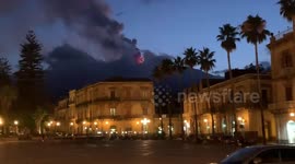 Mount Etna emits black smoke seen from Piazza del Duomo, Giarre