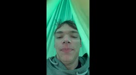 Fearless lad chills in a hammock... suspended from a BRIDGE!