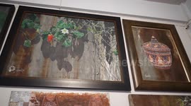 Artist makes pictures from reclaimed zinc roof tiles