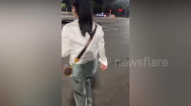 Cabbie almost swallowed up by sinkhole in China