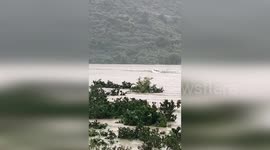 China: Two Villagers in China Sail Against the Current to Rescue Man from Vehicles That Fell into the River