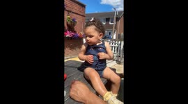 Toddler doesn't want to obey the no-eating instructions about her hamburger