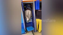 Large python hiding behind ATM extracted by Thai rescuers