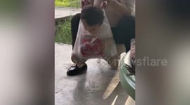 Plastic bag snaps while parent put boy inside