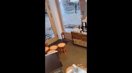 Flood enters cafe following heavy rain in Taiwan