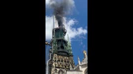 Rouen cathedral spire engulfed in flames