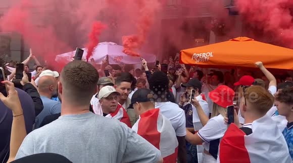 England fans sing ‘Ten German Bombers’ and set off smoke flares in London ahead of the Euro 2024 final with Spain