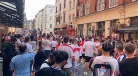 England kick around a football on the streets of Soho in London ahead of the Euro 2024 football final with Spain