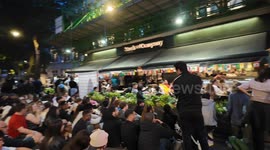England football fans look on in horror as they watch a TV screen at a restaurant in Leicester Square as Spanish football fans gleefully watch their team win