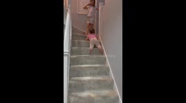 Child finds unique method for stairway descent in London
