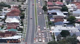 Dirt bike riders ride in a group through Windang doing stunts and running red light