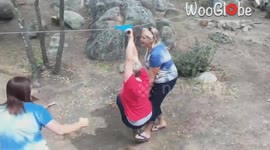 Adventure gone wrong: Woman struggles on zip line during company trip