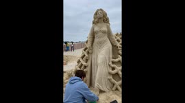 Dmitry Klimenko, sculptor, wins second place for his beautiful goddess sand sculpture at the 2024 Hampton Beach Sand Sculpting Classic