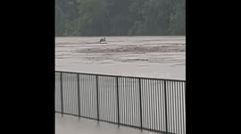 Jet ski drifts towards dam in Branson floods