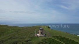 Historic coastal lookout tower moved inland brick by brick to save it from the sea