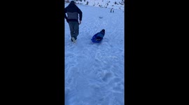 Dad Avoids Sledding Collision