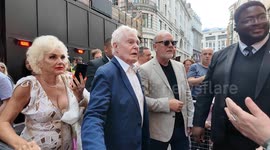 After a security guard would not let him in Derek Jacobi finally is let in to arrive at the Hello Dolly press night