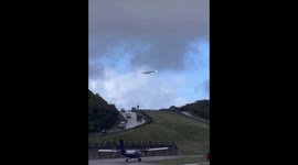 Crazy prop plane landing in high wind