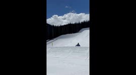 Snowboarder hits a superman frontflip on large jump, two camera angles, sunny day