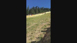 people chasing roll of cheese down a hill, woman falls face first, scorpions and slides 20 feet on her face