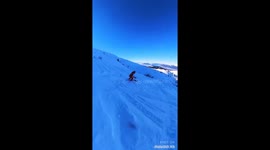 skier does a triple backflip completely out of control
