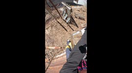 guy on snowboard, walks straight out of shed and grinds 3 rails on a unique backyard snow set up