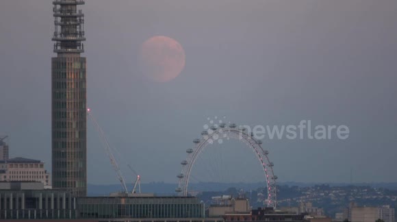 The July Full Moon known as the Buck Moon rises near the London Eye