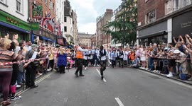 Drink flows at The annual Soho Waiters race takes place on the streets of Soho