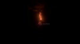 Erupting Stromboli & mesmerizing lava flow combat the sheer darkness of the night
