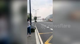 Woman caught in sudden downpour while trying to record localised rain