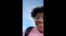 Pigeon lands on walker's hair in Santander, Spain