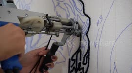 Rug maker puts famous faces on his mats