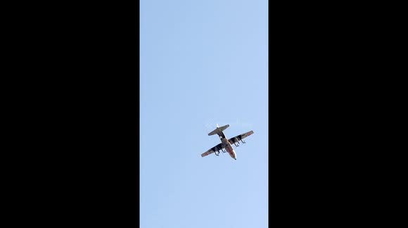 Dropping humanitarian aid on camps for displaced Palestinians in the Mawasi Khan Yunis area in the southern Gaza Strip