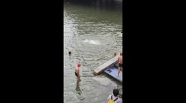 Elderly man preps for swim in with unique warm-up routine
