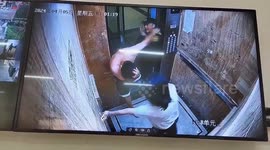 Heroic security guard subdues man attacking girlfriend in elevator in China