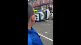Overturned cop car highlights the intensity of Leeds riot