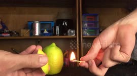 Slow-motion footage of a lemon creating a ball of fire