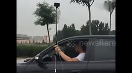 Man attached to IV drip drags it down the road while driving
