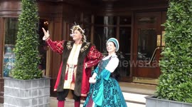 Horrible Histories Terrible Tudors stars Neal Foster and Emma Swan in character pose outside the hotel.