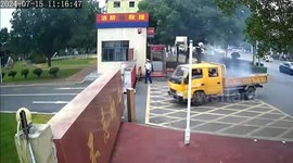 Quick-thinking firefighters extinguish blazing truck that drove into fire station