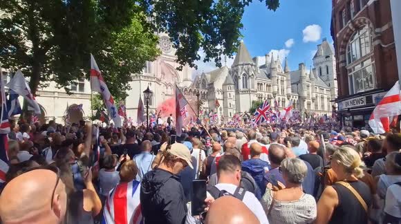 Flares at the Unite the kingdom protest organised by Tommy Robinson. Outside the Royal court of justice