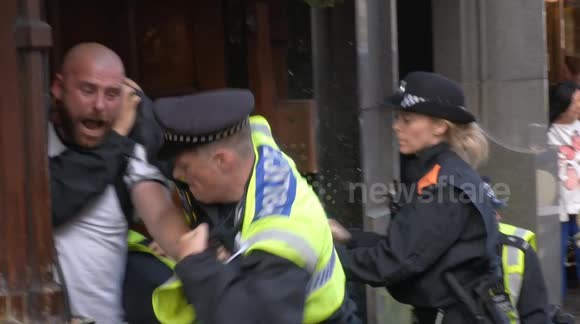 Clashes erupt following Tommy Robinson pro-Britain rally in Central ...
