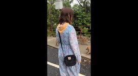 Monkeys climb on woman's head in Thailand